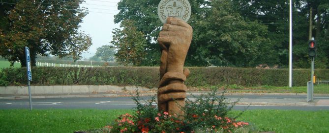 Hand sculpture with plaque stating Churchill Langford 2002