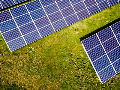 Solar panels in a field photographed from above